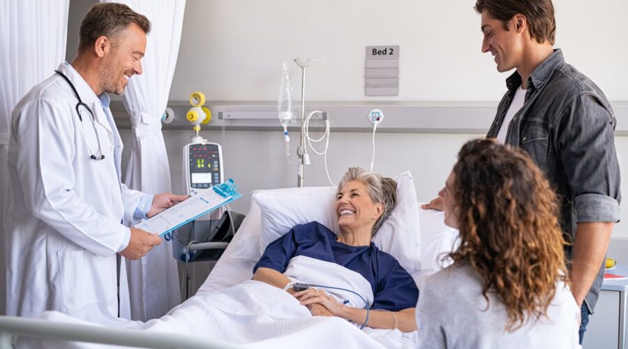 Doctor visiting senior patient with family